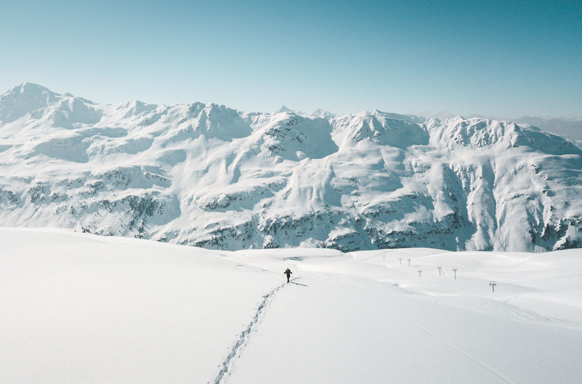 Travel blogger Selena Taylor snowshoeing in the mountains Davos Switzerland Swiss Alps Ski Town