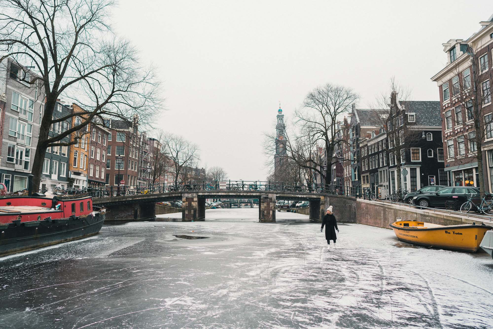 Travel blogger Selena Taylor ice skating on the frozen canals in Amsterdam The Netherlands