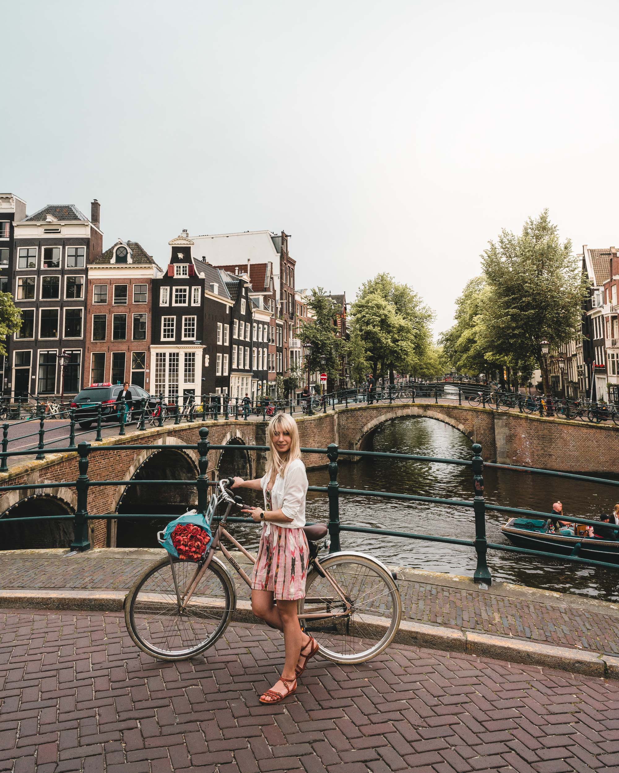 Biking with tulips through Amsterdam, The Netherlands