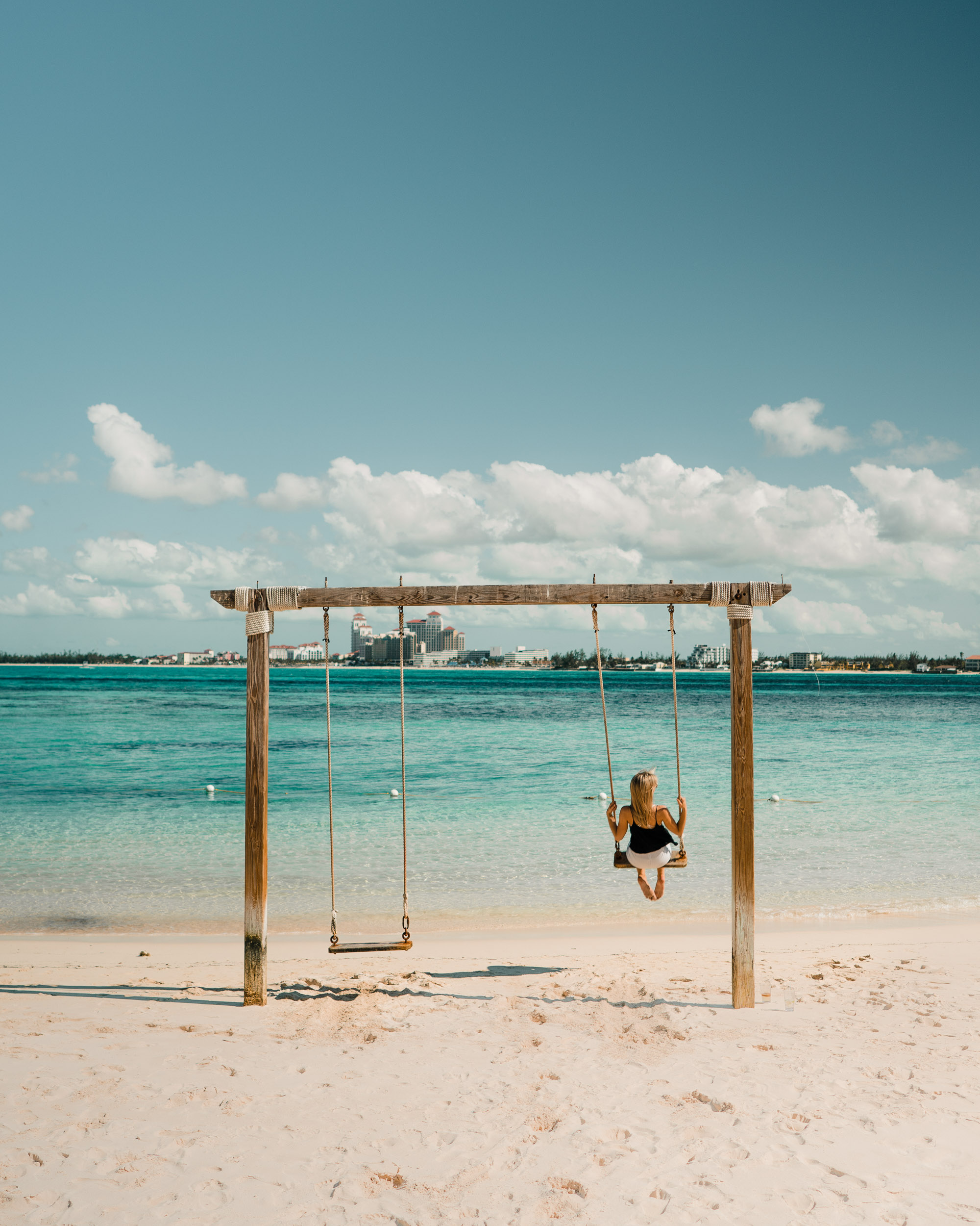 Swing on the water at Sandals private island resort in Nassau Bahamas