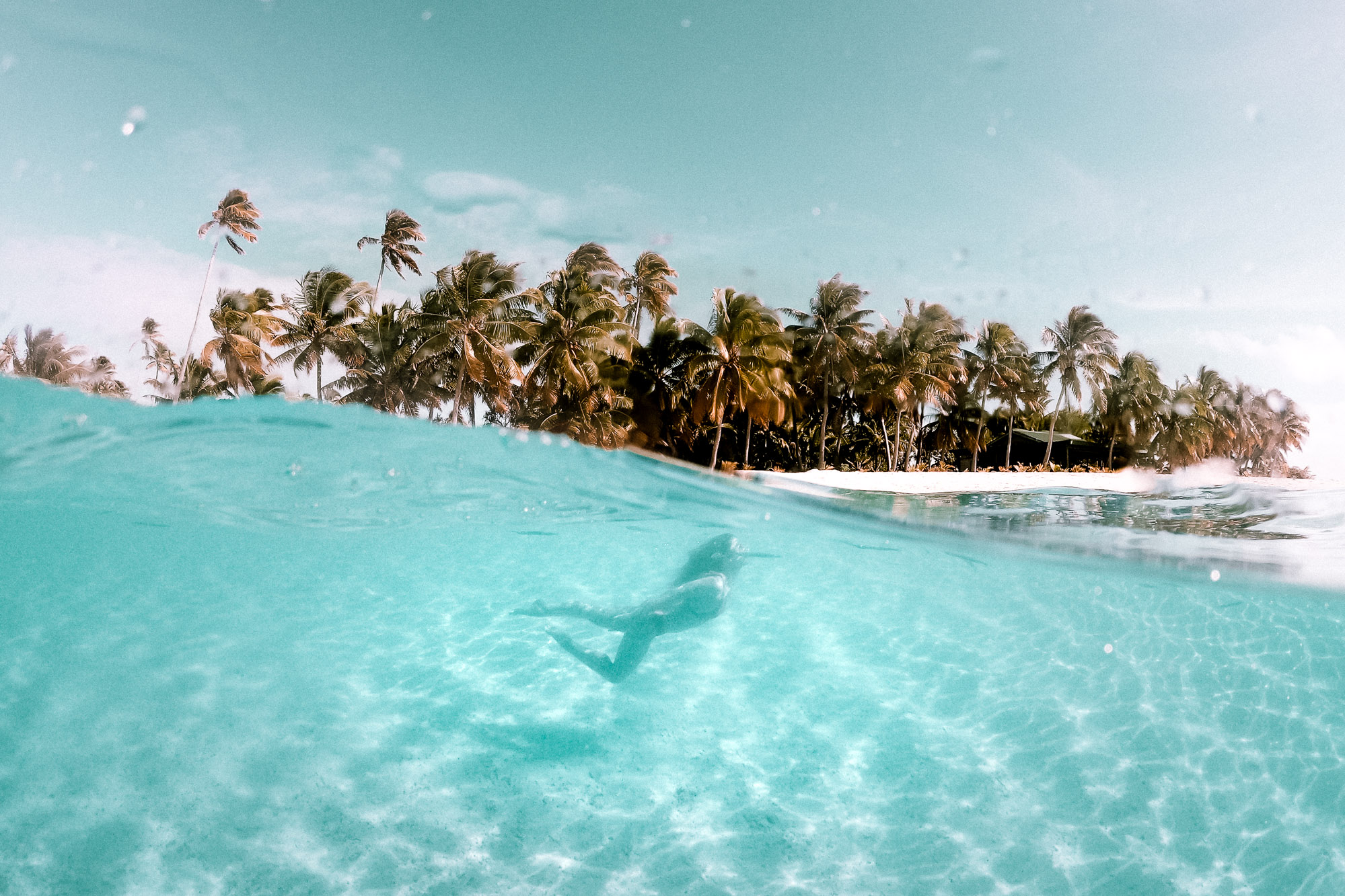 Underwater shot in the turquoise water of One Foot Island, Aitutaki, Cook Islands | Find Us Lost