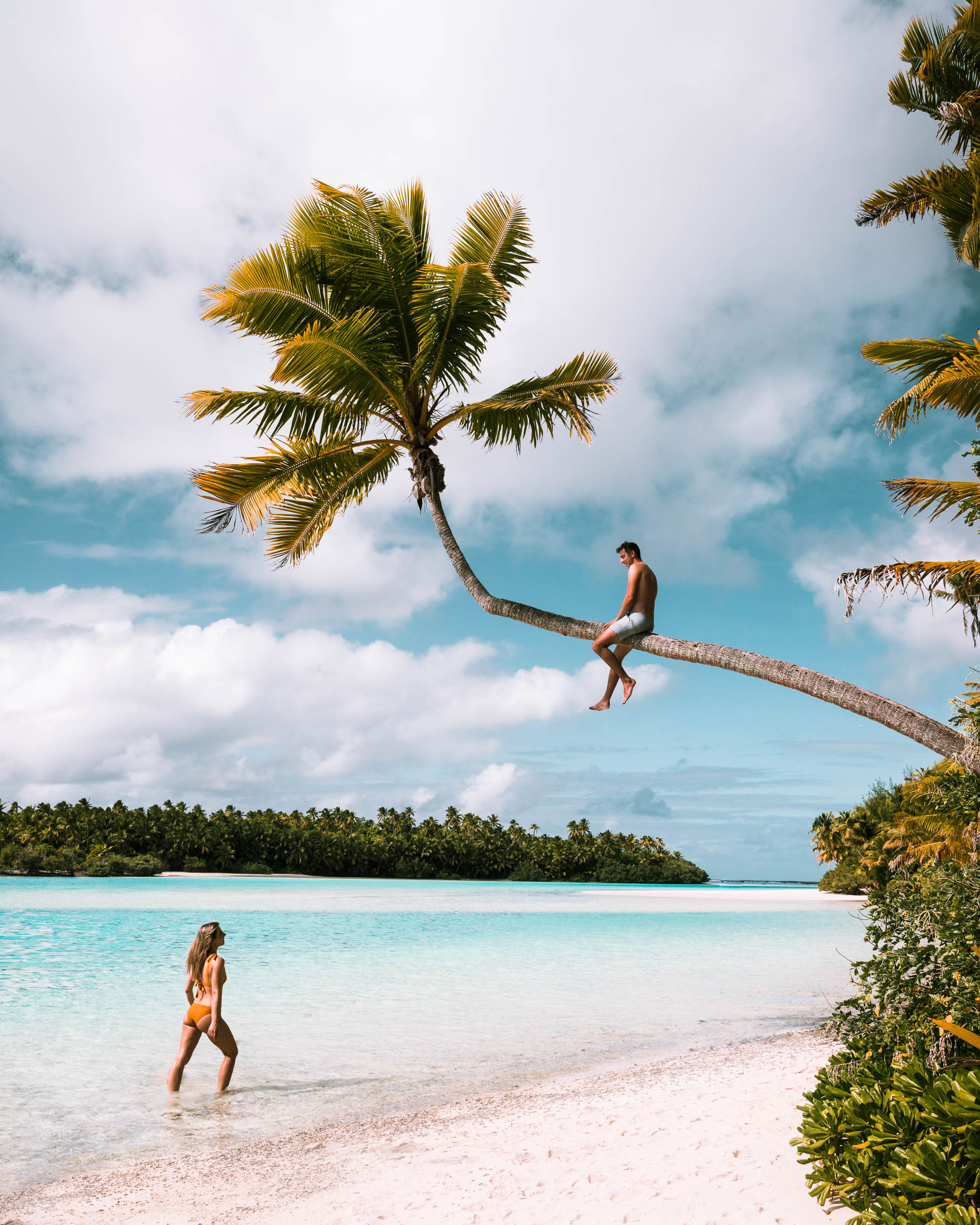 Palm tree climbs and clear water with Selena and Jacob Taylor at One Foot Island in the Cook Islands