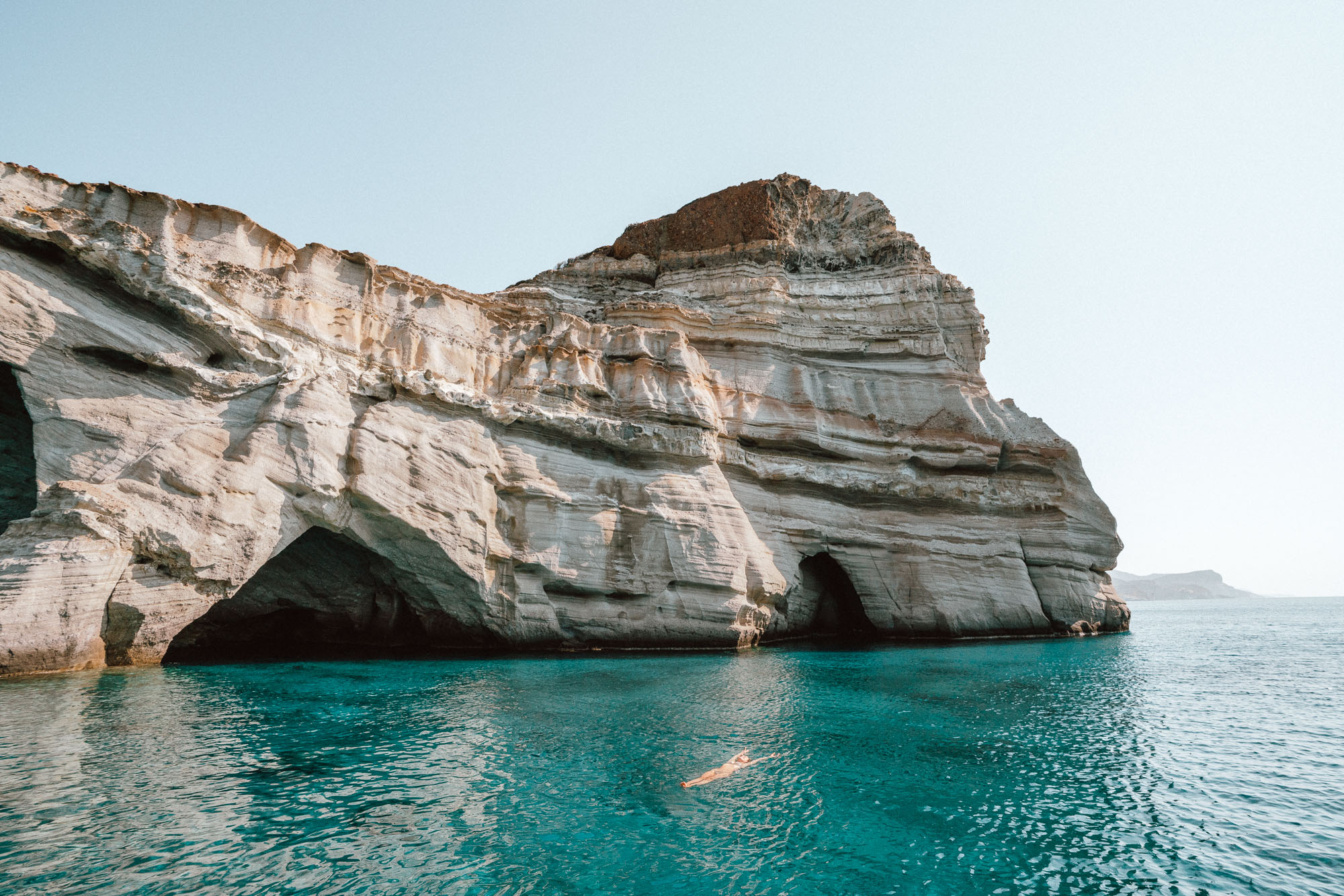 September Giveaways | Kleftiko caves in Milos, Greek Islands via @finduslost