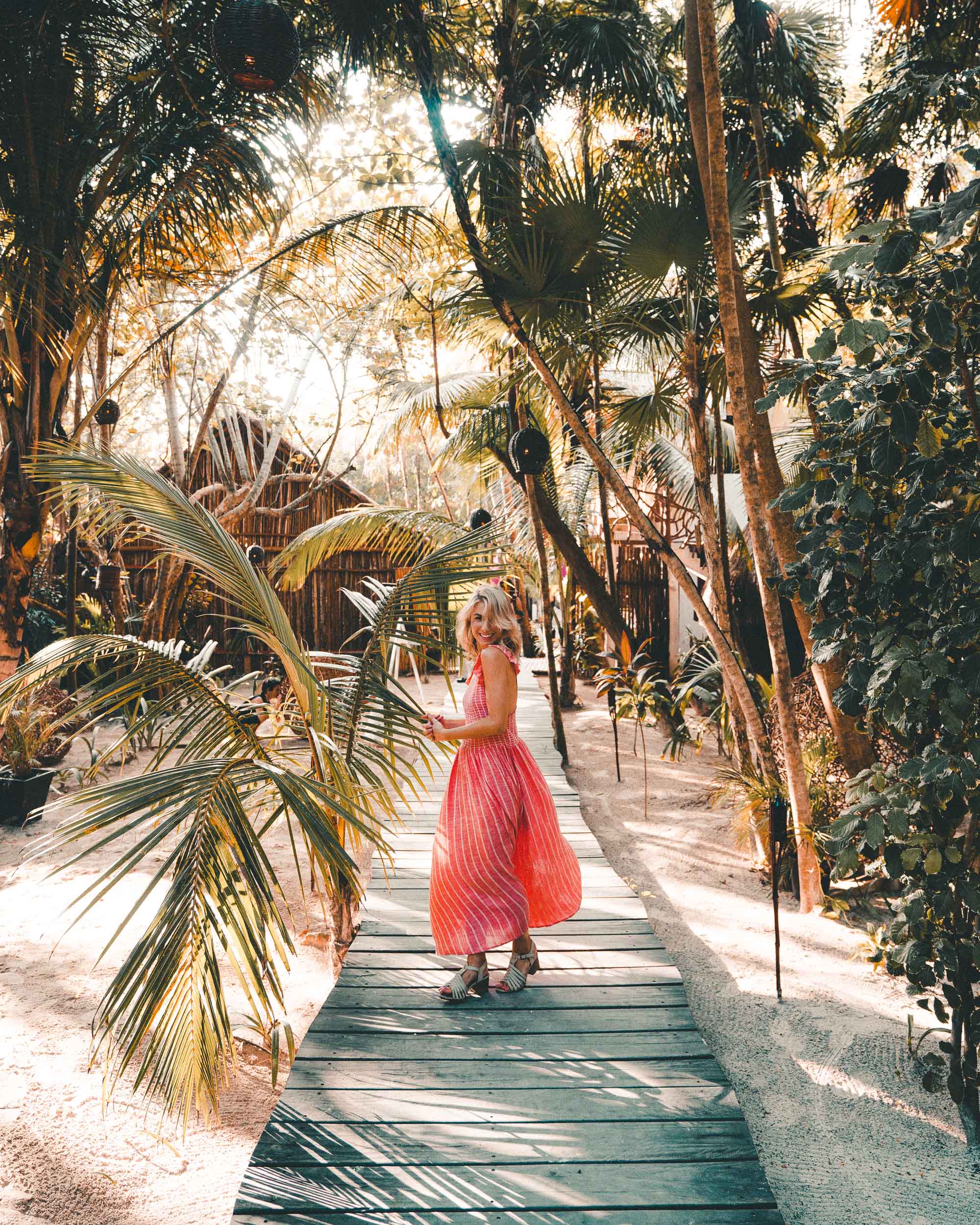 Pink dress in Tulum Mexico via Find Us Lost