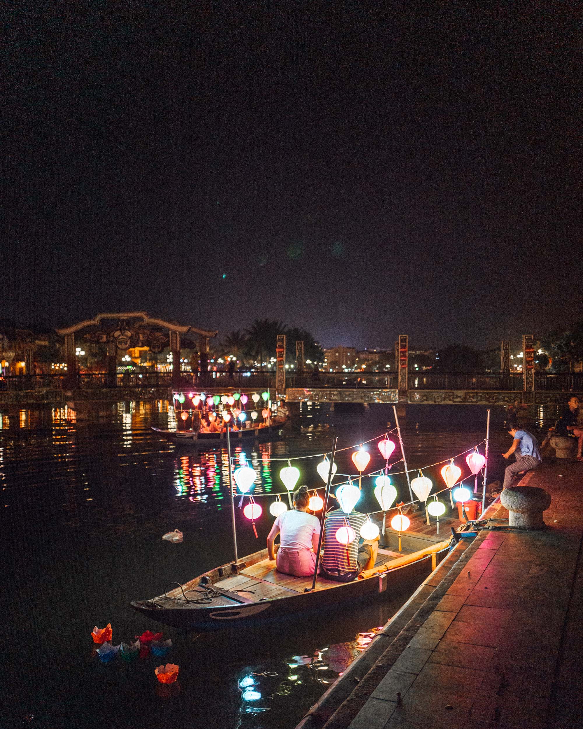 Lanterns and boats at night in Hoi An Vietnam