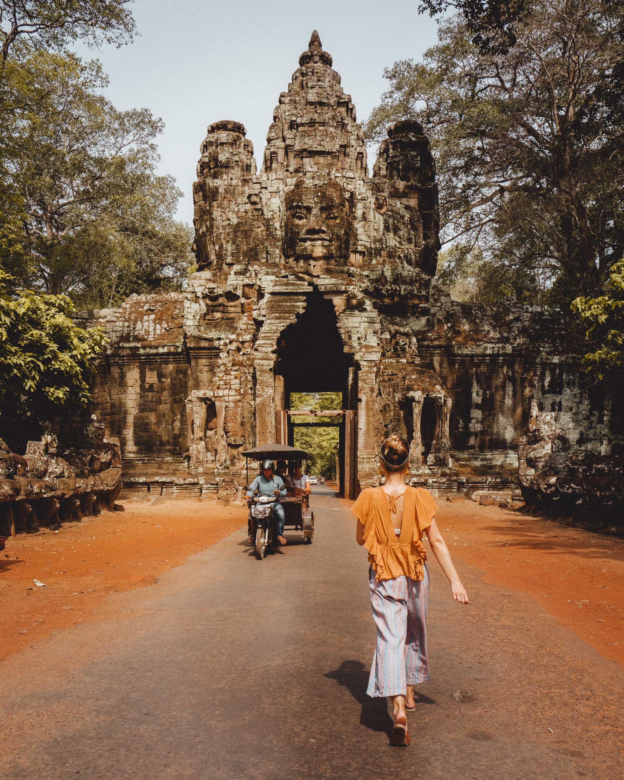 Bayon temple entrance with tuk tuk in Angkor Wat Cambodia