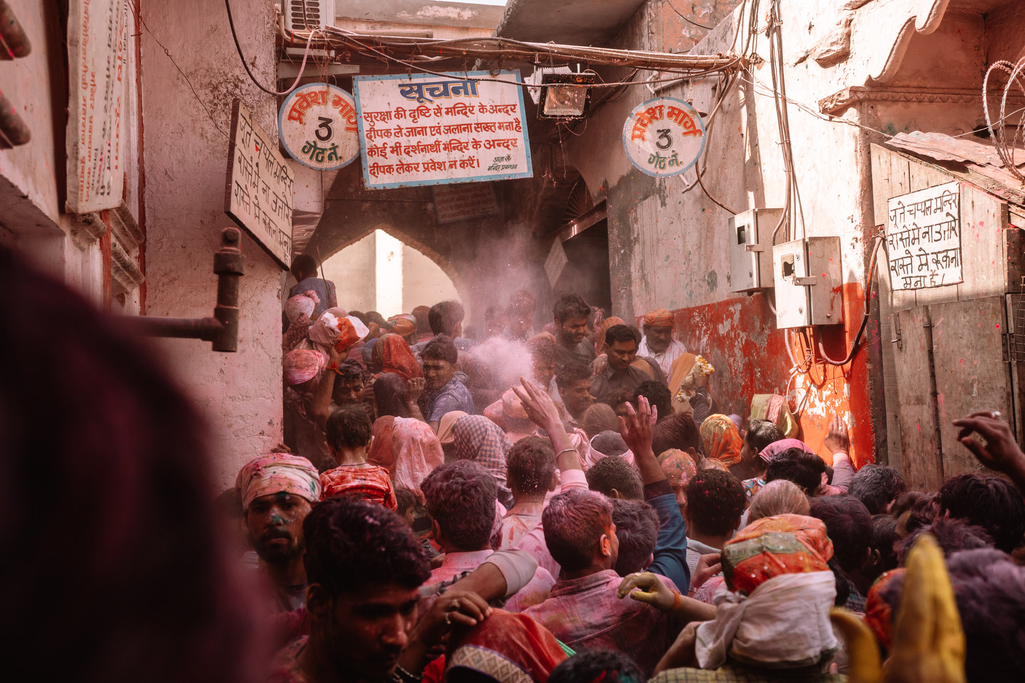 A crowd of people covered with colorful powder during the celebration of Holi Festival in Vrindavan, India via @finduslost